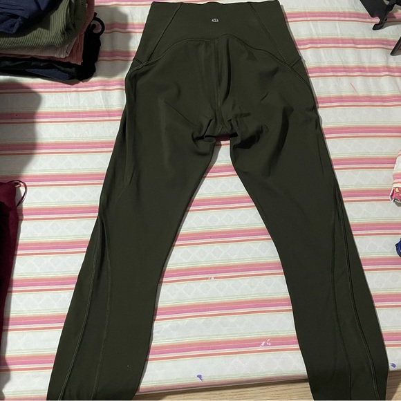 Lululemon high waisted legging in olive. Luxtreme material. Size 4. Mesh sides. - Picture 2 of 5